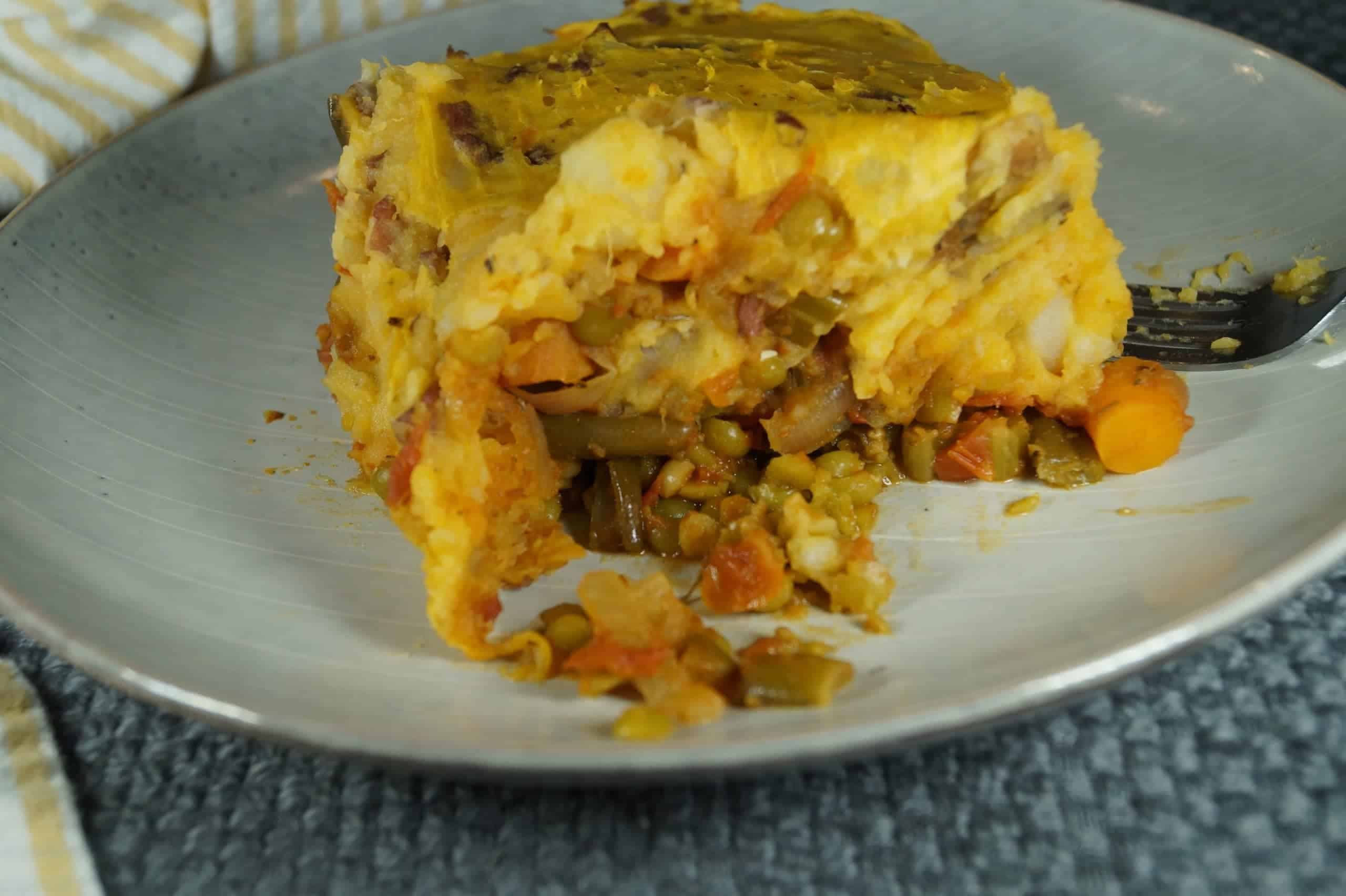 vegan lentil shepherd's pie with mashed potato topping in a baking dish