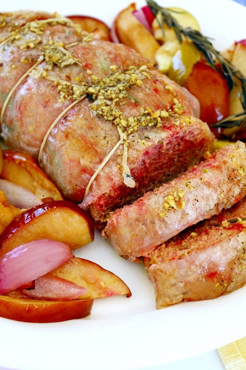 Vegan tenderloin roast served with apples and onions