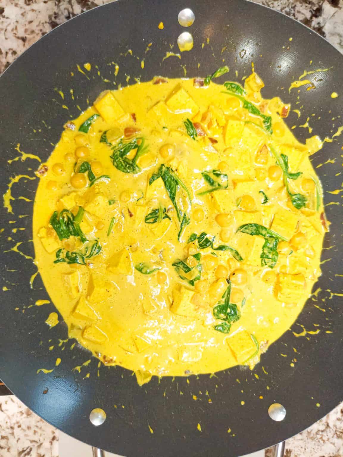 Creamy chickpea and tofu curry served with brown rice for a vegan fall dinner