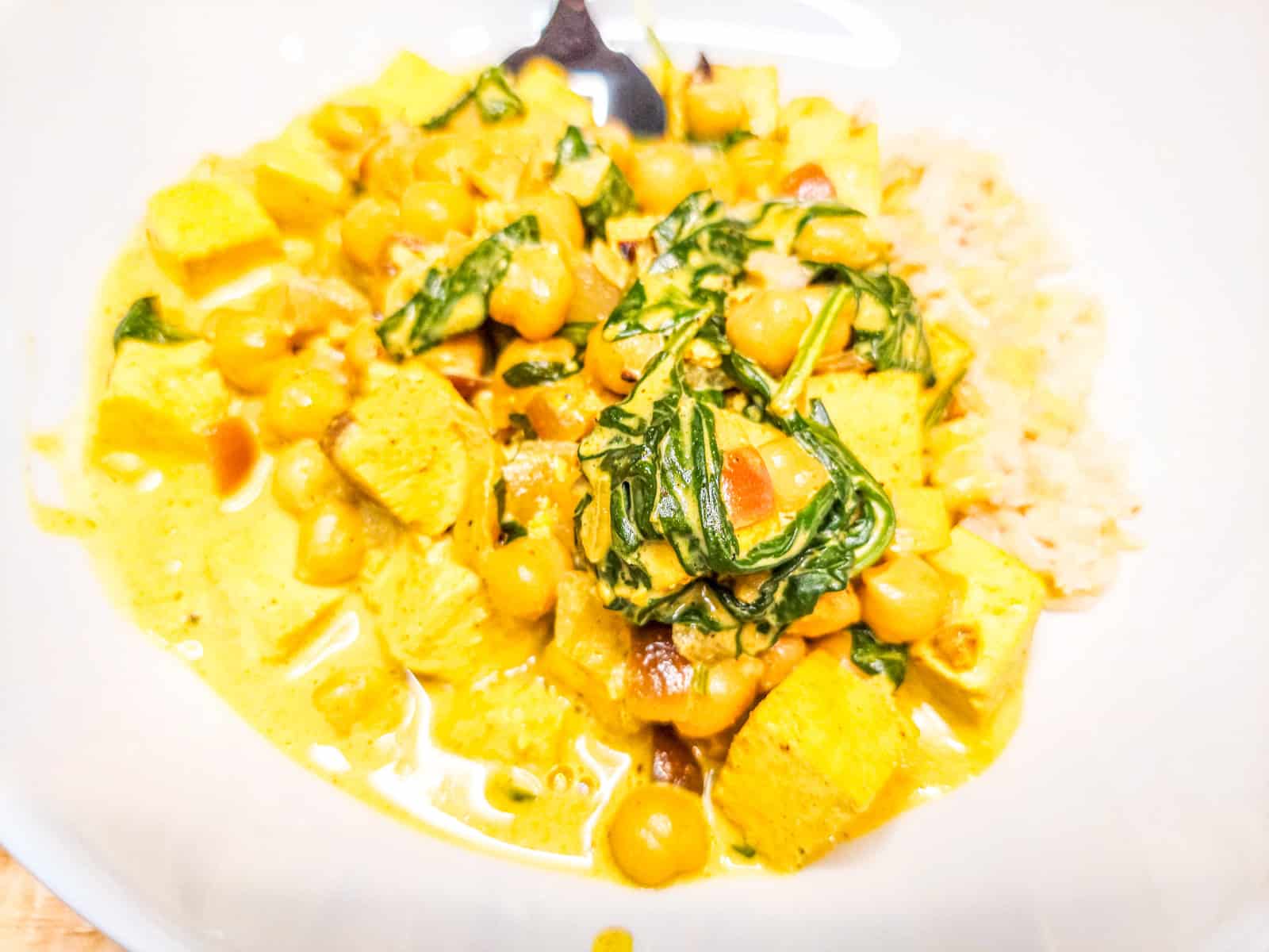 Chickpea and Tofu Curry with Spinach and Brown Rice: High-Protein Comfort High‑protein plant‑based meals with tofu, tempeh, lentils, and beans. Satisfying vegan recipes for lasting energy and fullness.