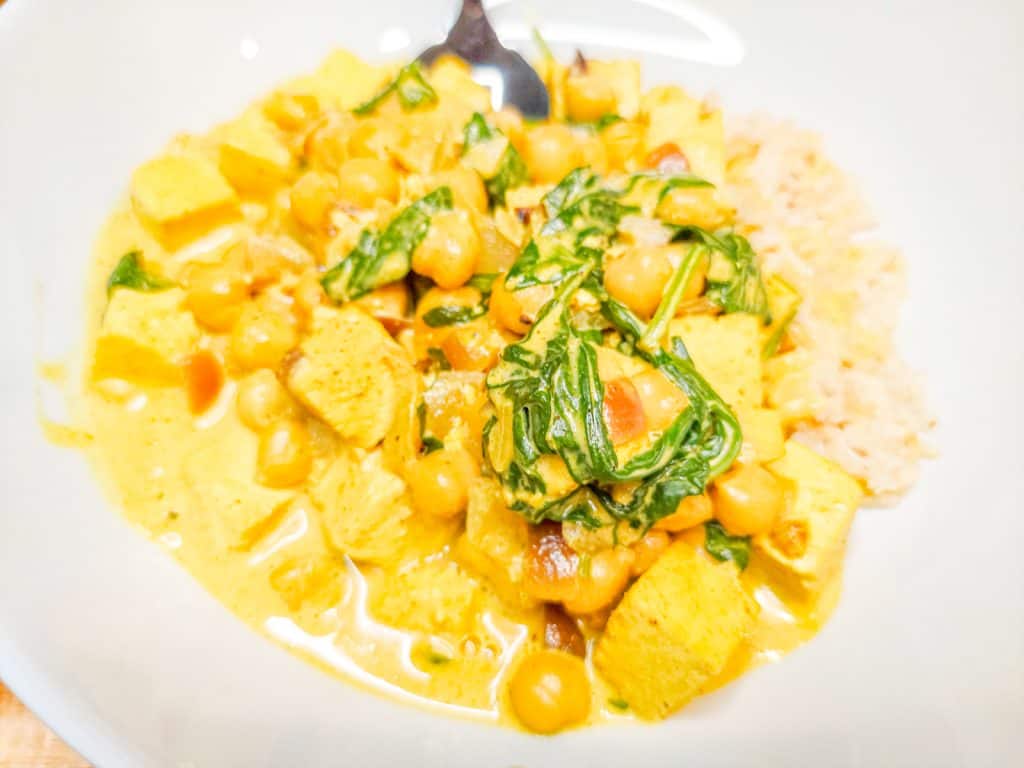 Chickpea and Tofu Curry with Spinach and Brown Rice: High-Protein Comfort