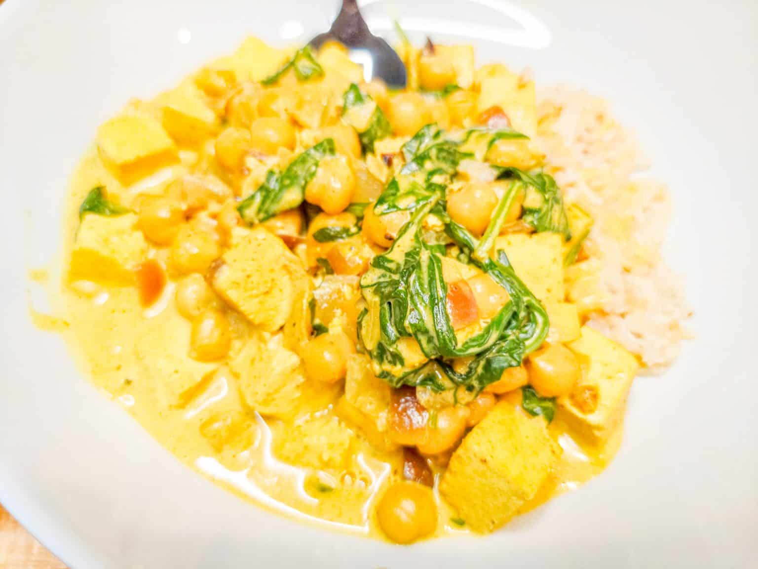Chickpea and tofu curry with spinach and brown rice