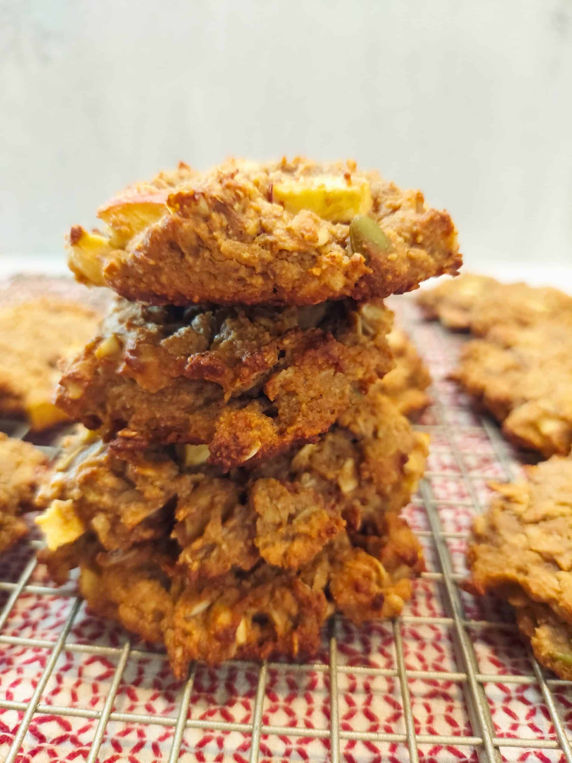 Apple cinnamon protein breakfast cookies stacked on a plate