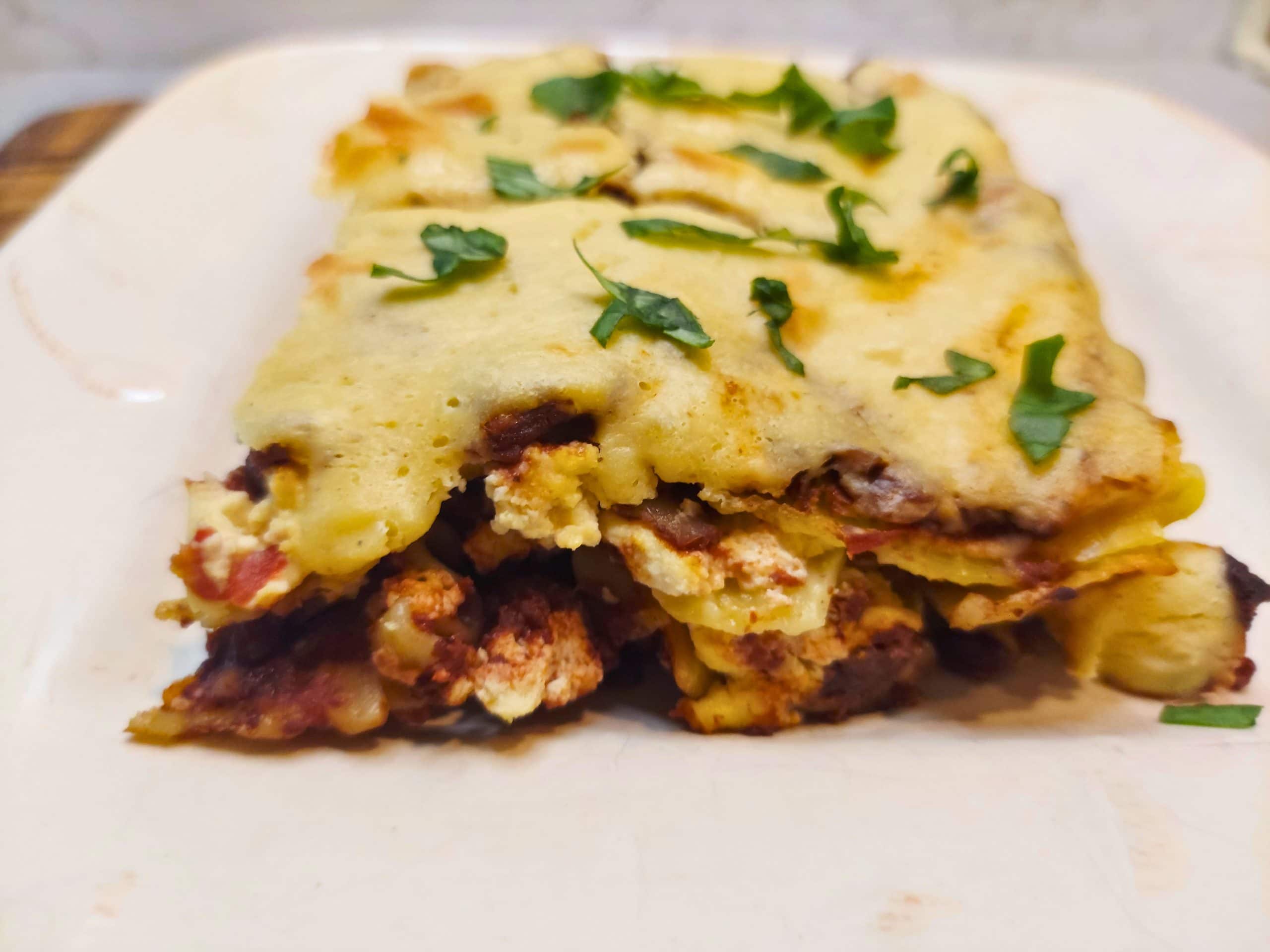 Layered vegan lasagna with lentil walnut sauce and tofu ricotta