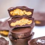 Chocolate peanut butter cups stacked on top of each other.