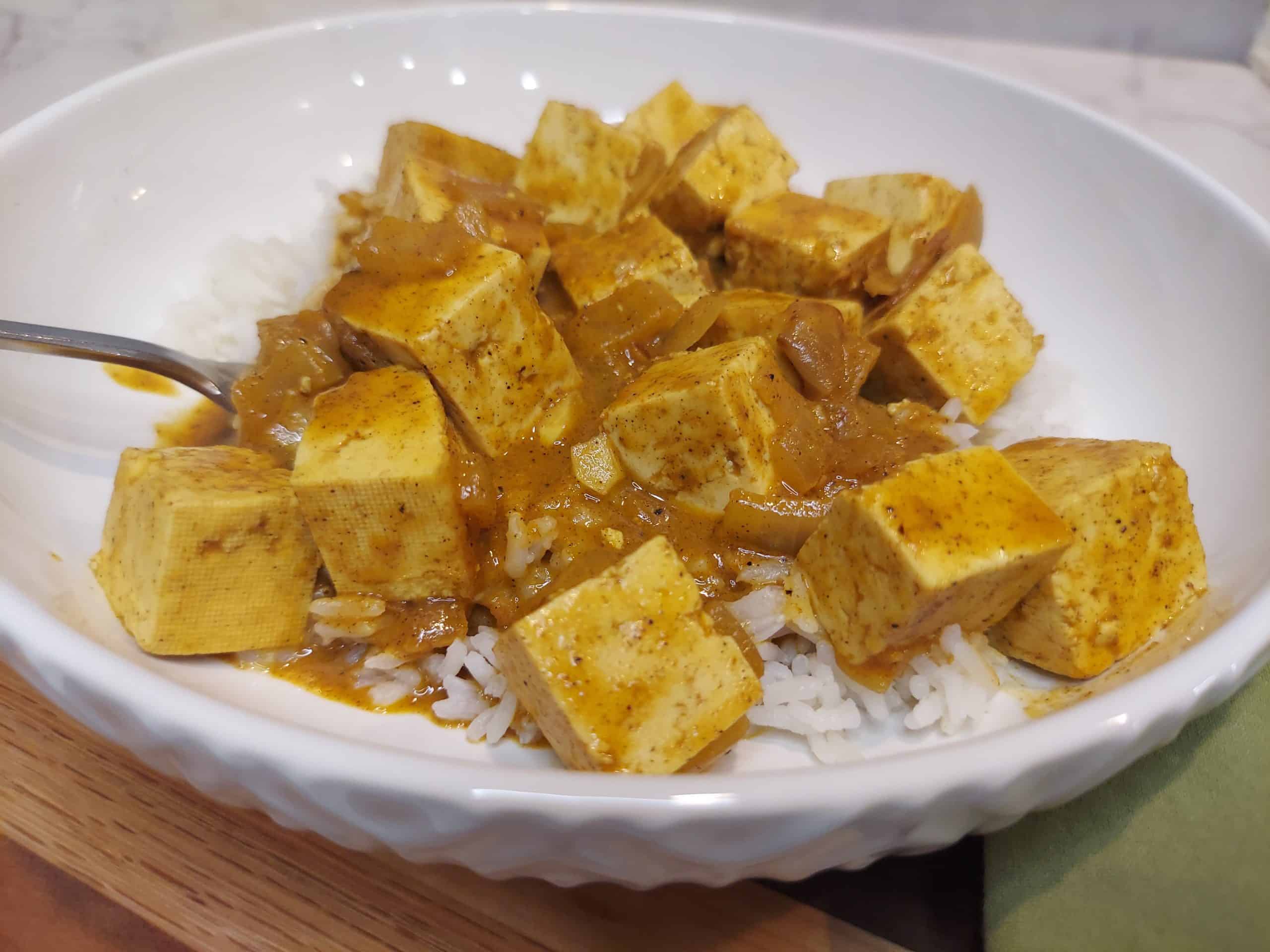 bowl of vegan butter tofu served over white rice