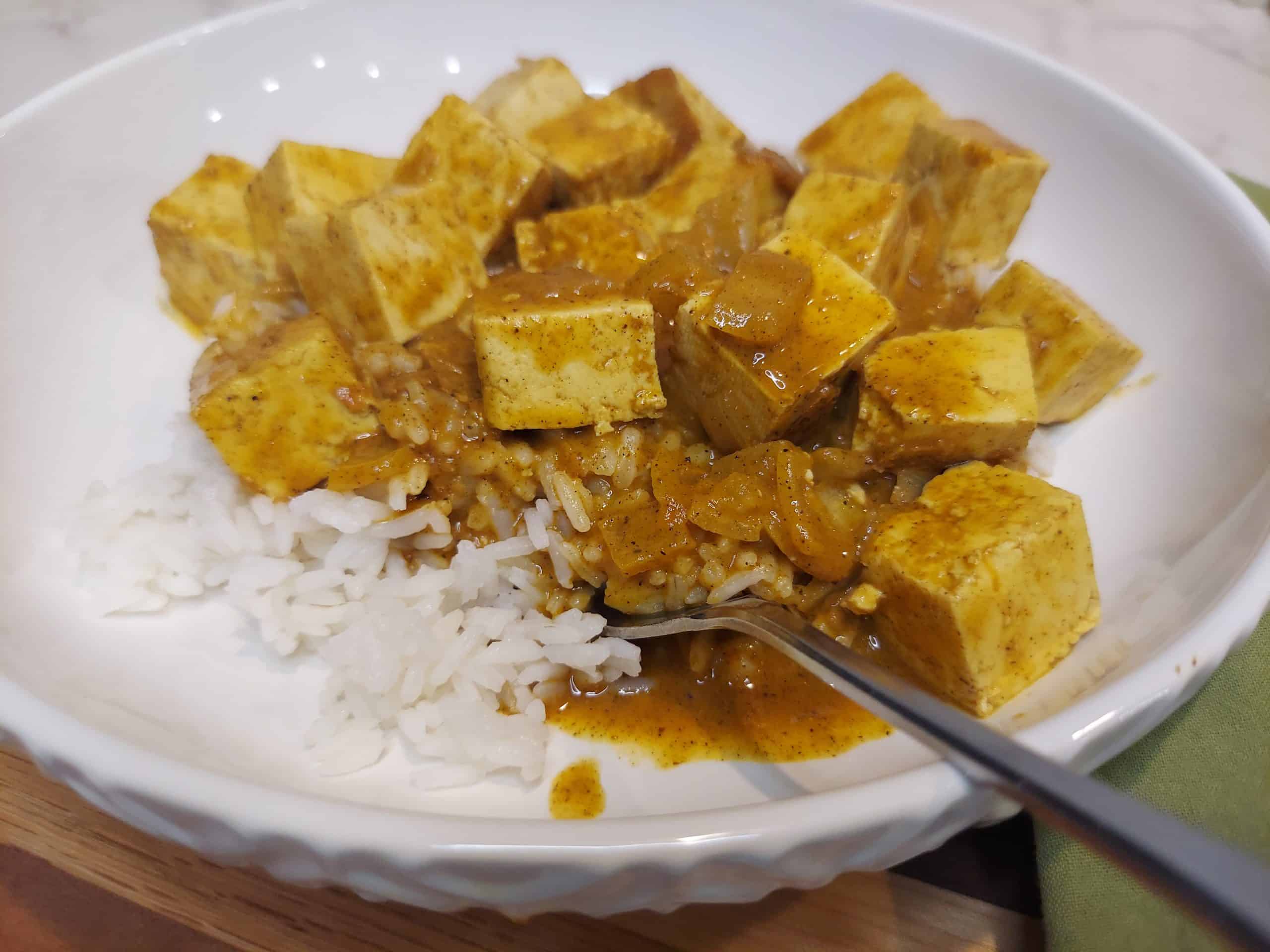 plated vegan butter tofu dinner with fluffy white rice
