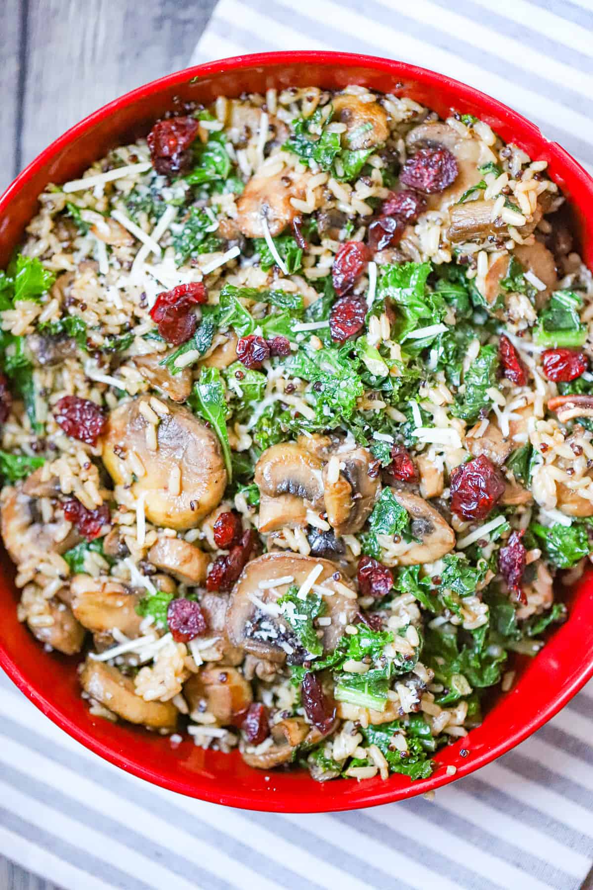 kale and quinoa bowl with wild rice, cranberries, and hemp hearts