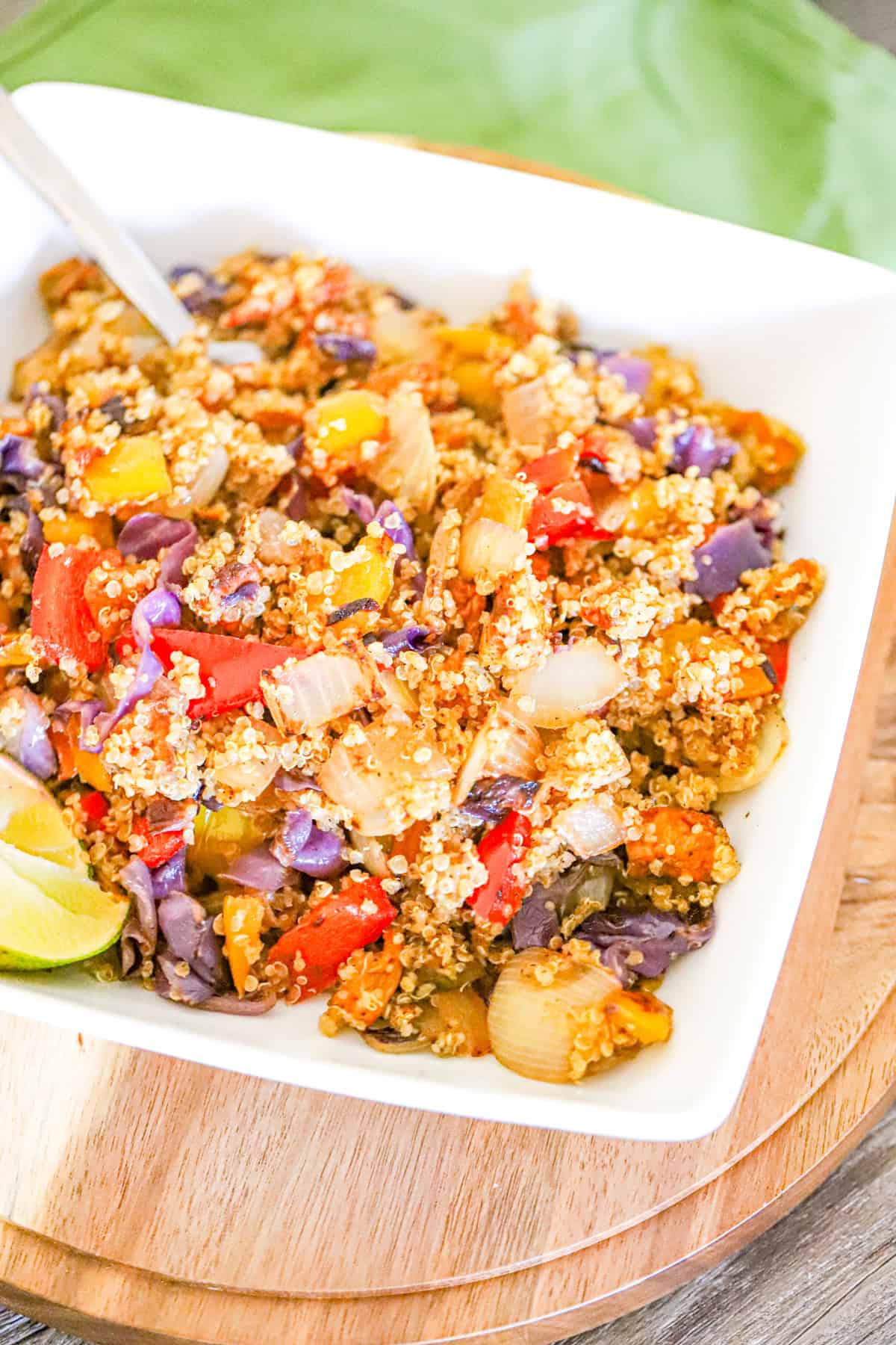 quinoa bowl with charred roasted bell peppers and caramelized onions